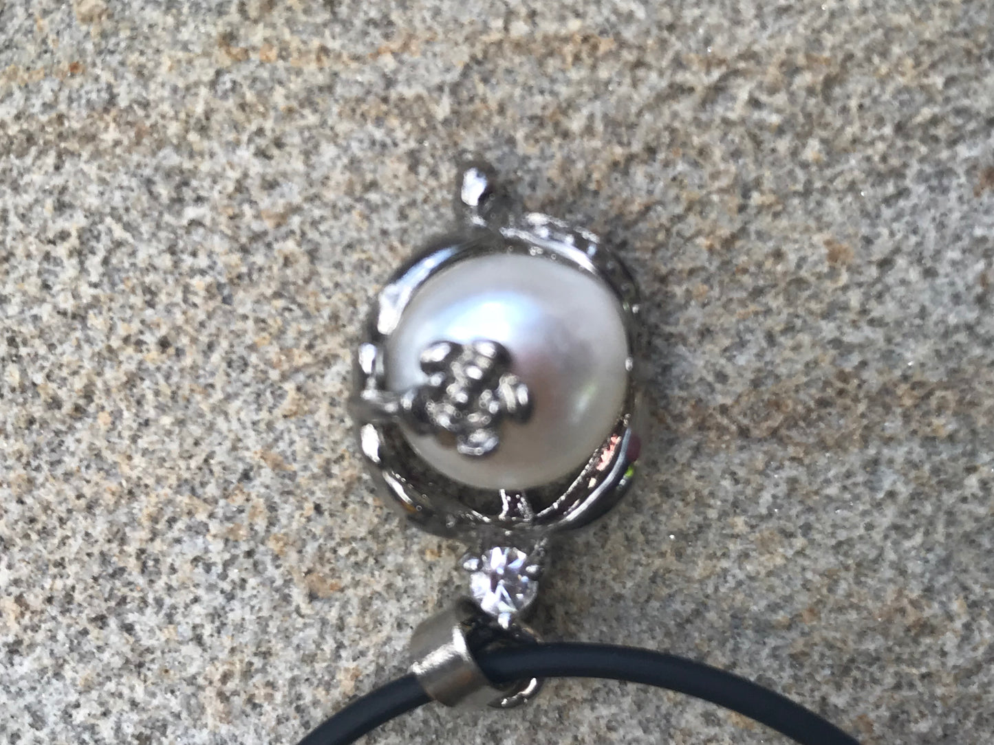 Single real pearl on black leather cord - The Lotus Wave