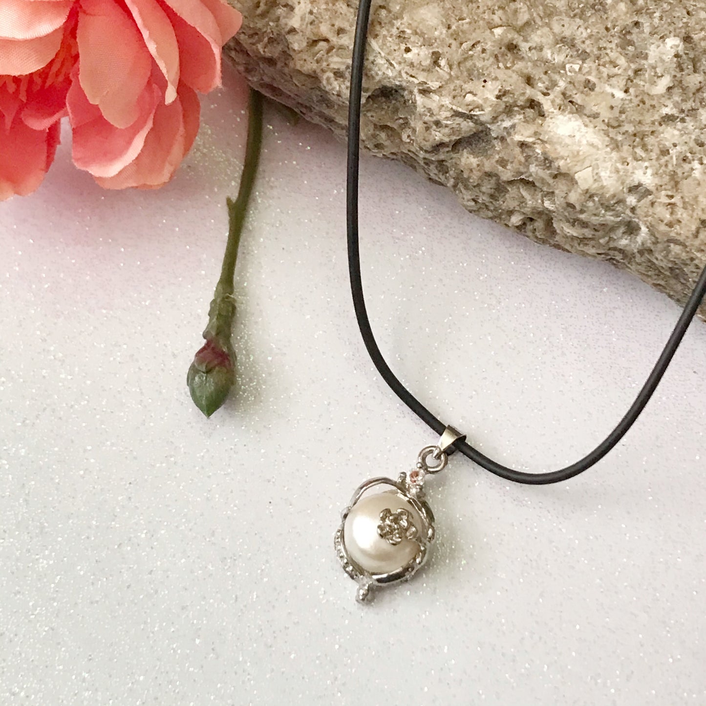 Single real pearl on black leather cord - The Lotus Wave