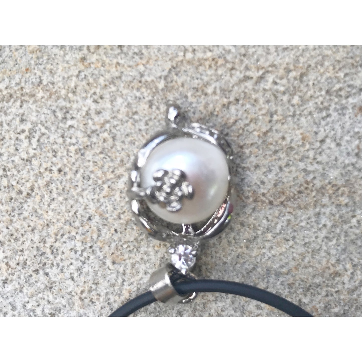 Single real pearl on black leather cord - The Lotus Wave