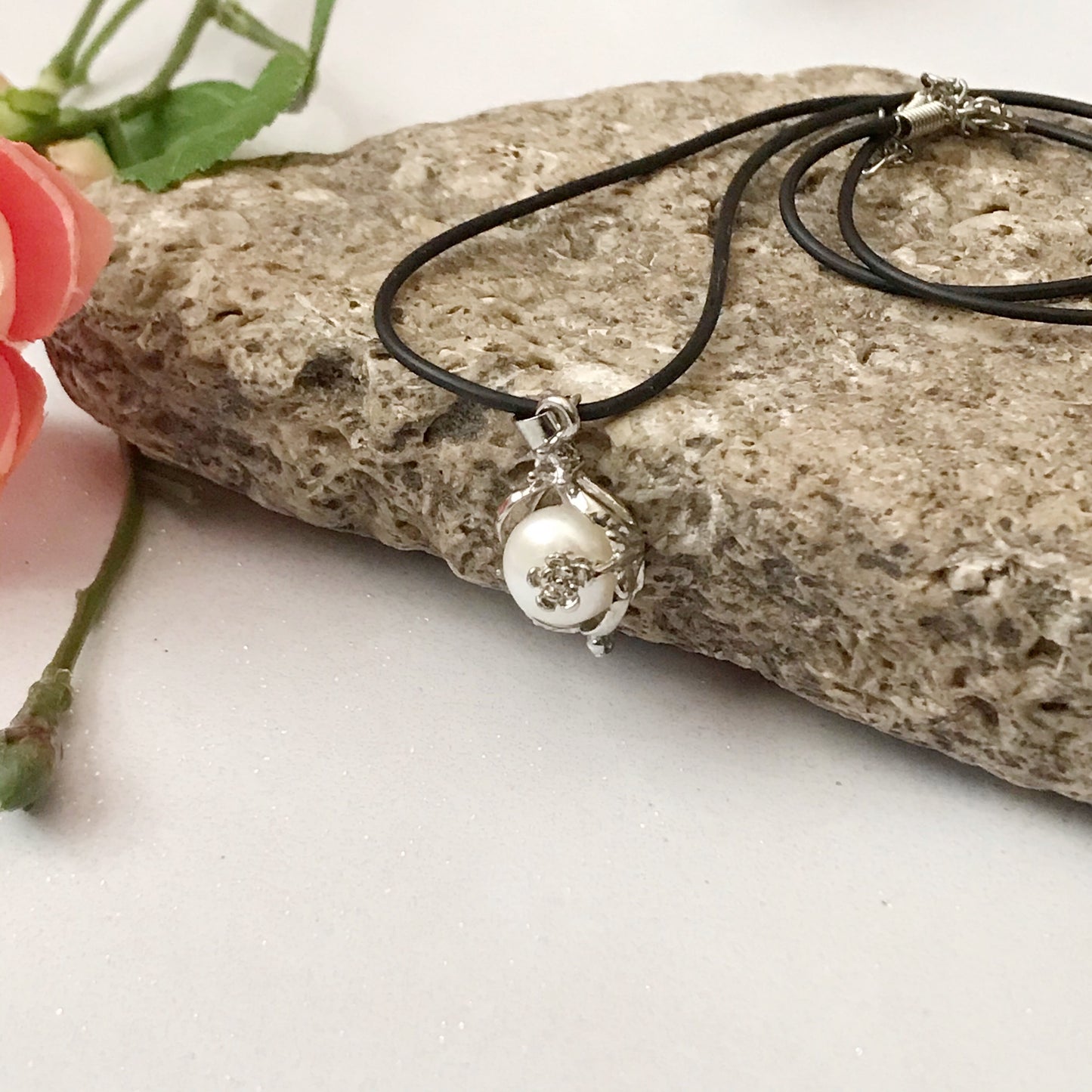 Single real pearl on black leather cord - The Lotus Wave