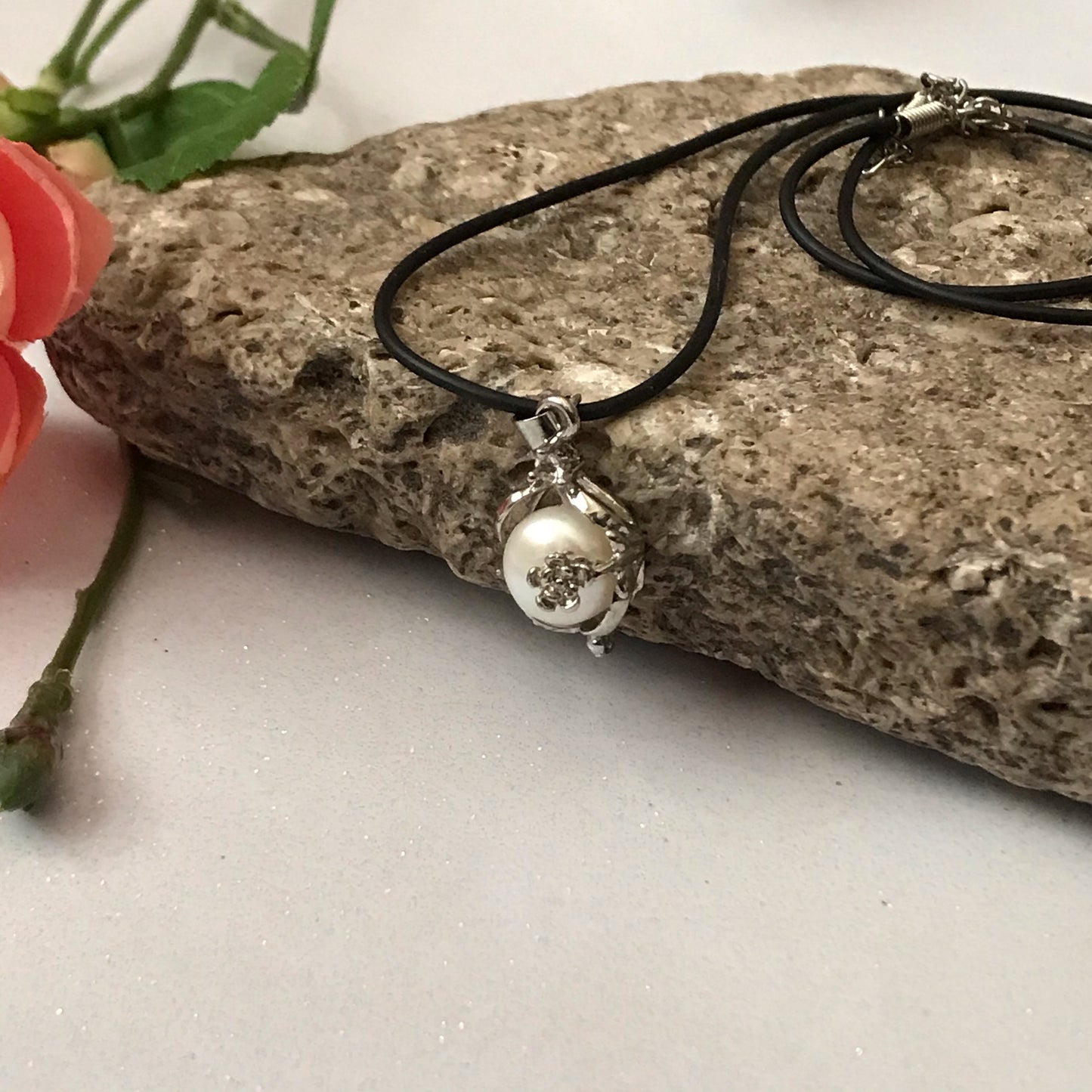 Single real pearl on black leather cord - The Lotus Wave