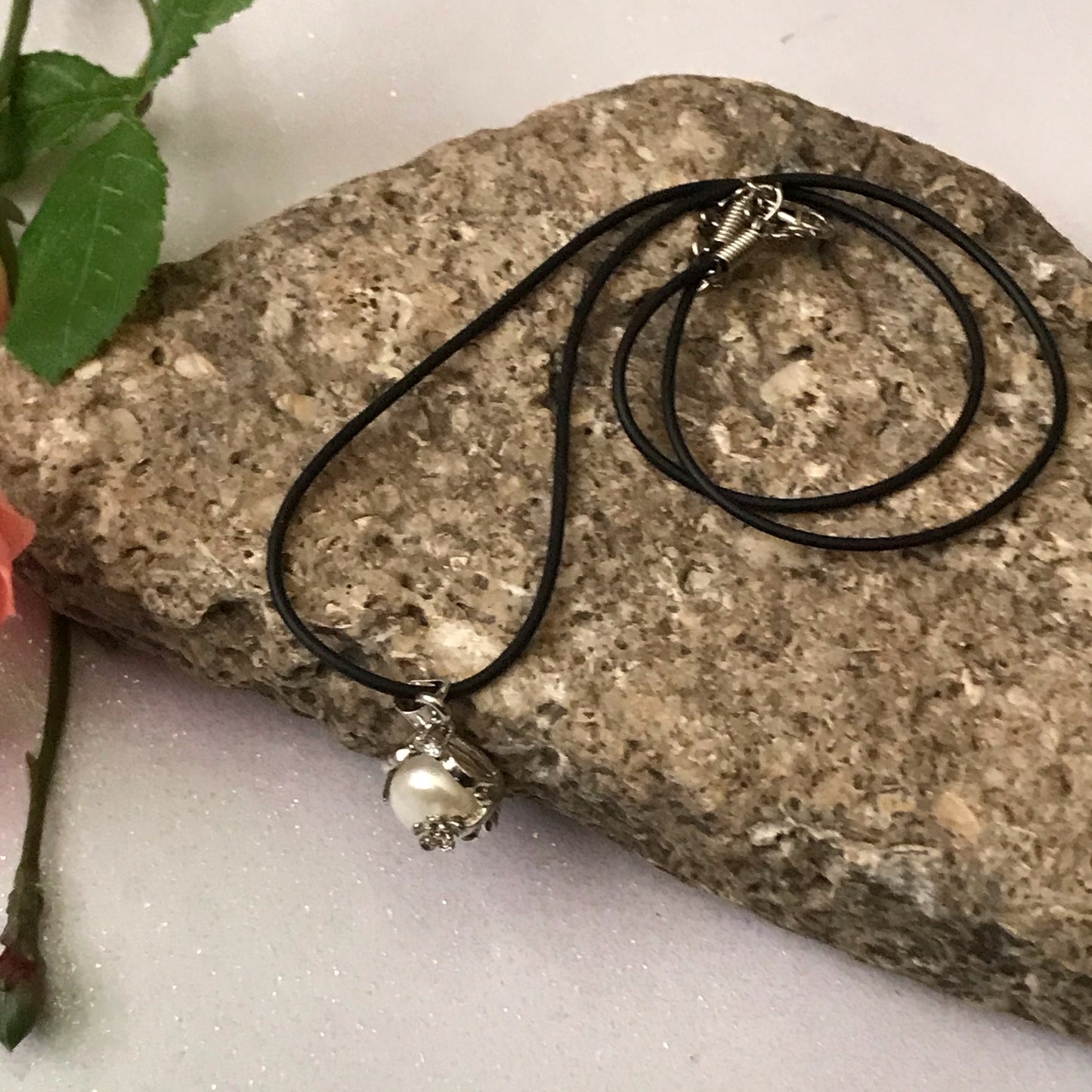 Single real pearl on black leather cord - The Lotus Wave