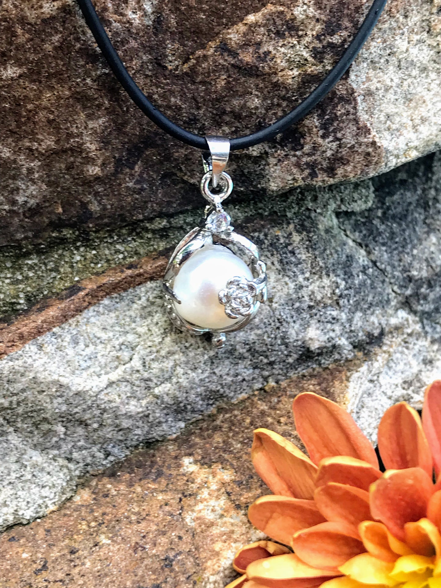 Single real pearl on black leather cord - The Lotus Wave